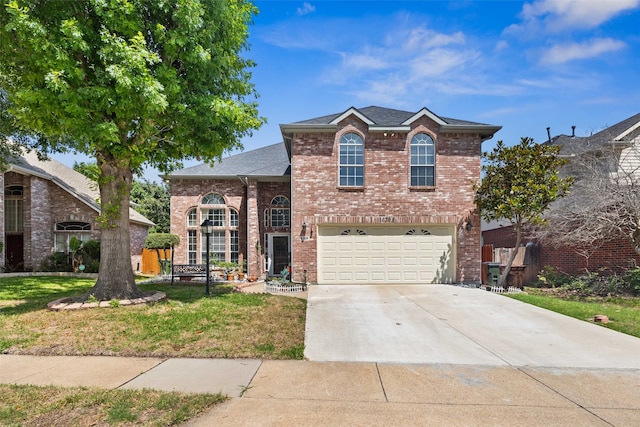 split level home featuring a garage and a front yard