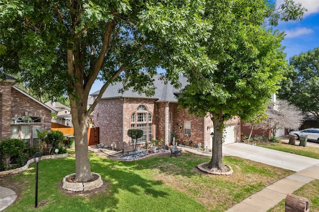 view of front of house with a garage and a front lawn