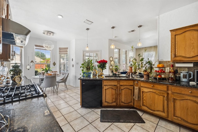 kitchen with dishwasher, sink, hanging light fixtures, range hood, and dark stone countertops