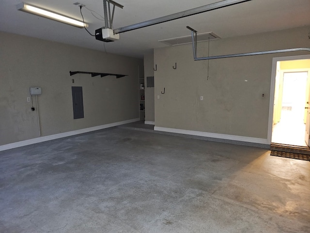 garage featuring electric panel and a garage door opener