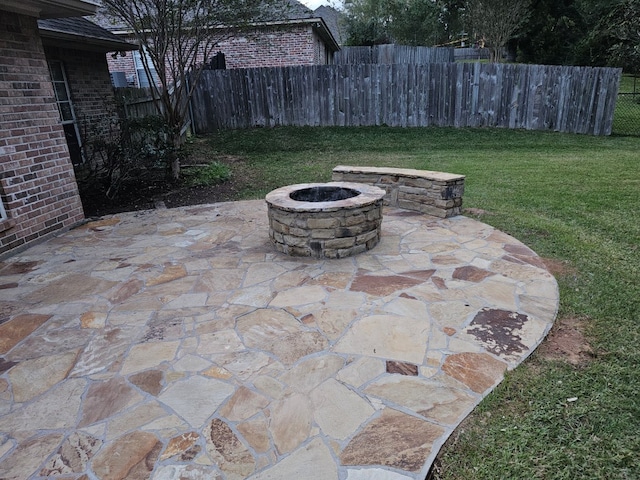 view of patio / terrace with a fire pit