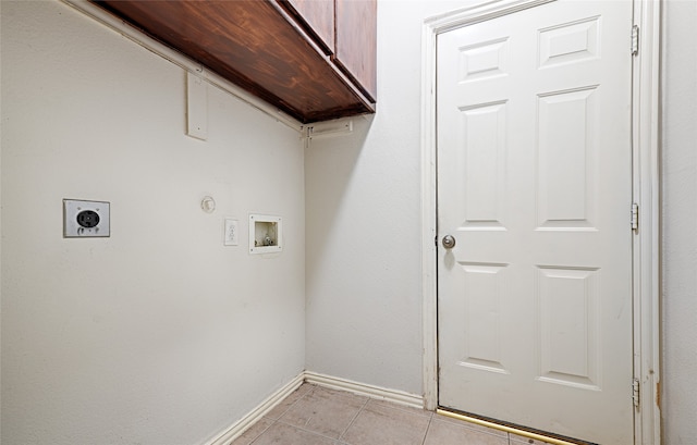 laundry room featuring washer hookup, electric dryer hookup, light tile patterned flooring, and cabinets