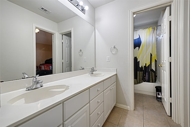 bathroom featuring tile patterned flooring and vanity