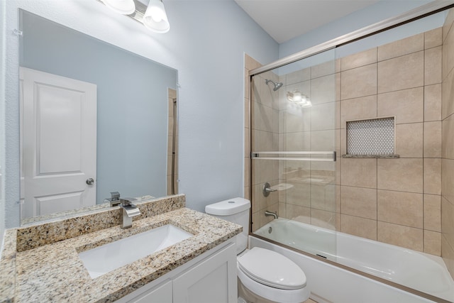 full bathroom featuring vanity, toilet, and enclosed tub / shower combo