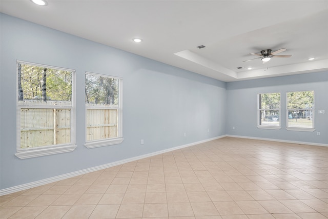 unfurnished room featuring light tile patterned flooring, plenty of natural light, and ceiling fan