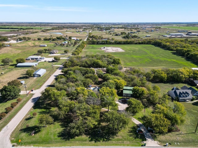 birds eye view of property with a rural view