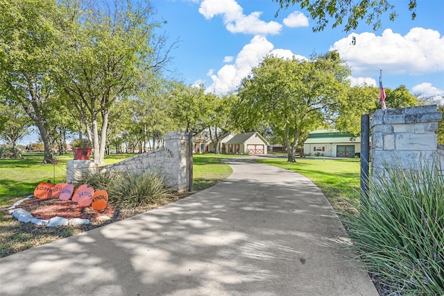 view of property's community with a lawn