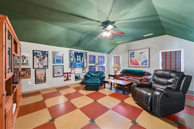 interior space with tile patterned floors, baseboards, vaulted ceiling, and ceiling fan