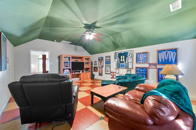 living area featuring visible vents, tile patterned floors, ceiling fan, and vaulted ceiling