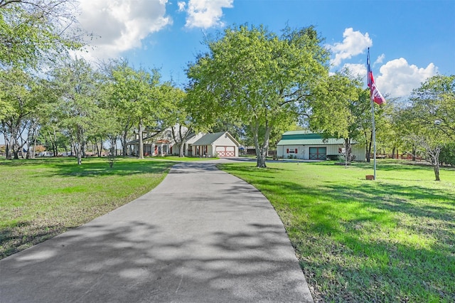 view of home's community with a yard