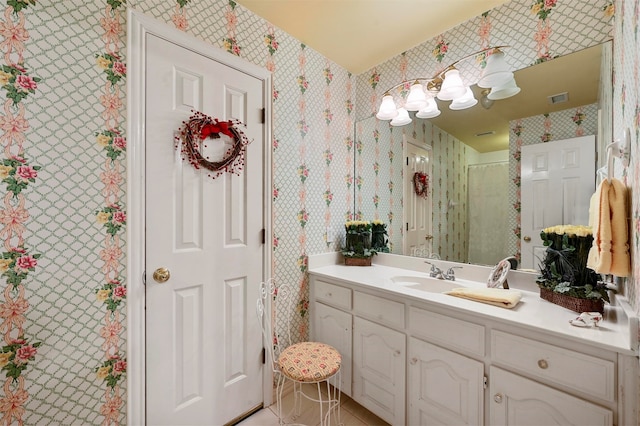 bathroom featuring vanity and a shower