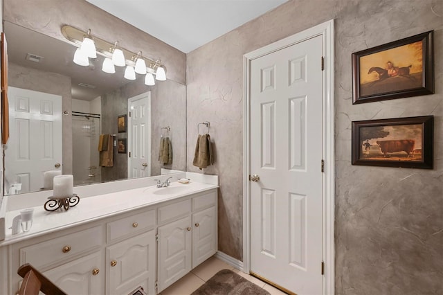 bathroom with visible vents, tile patterned floors, and vanity