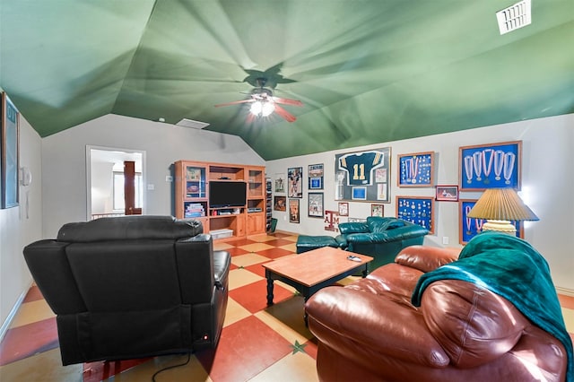 living room with ceiling fan and lofted ceiling