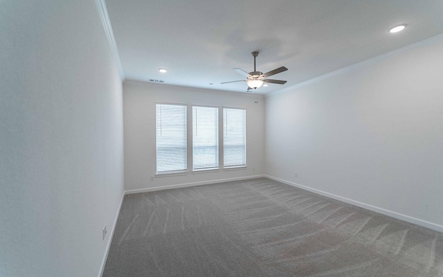 carpeted spare room featuring baseboards, ceiling fan, recessed lighting, and crown molding