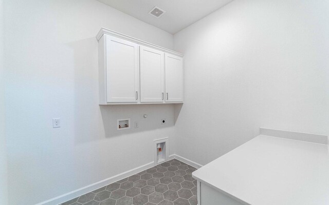 bathroom with tile patterned flooring, vanity, and an enclosed shower