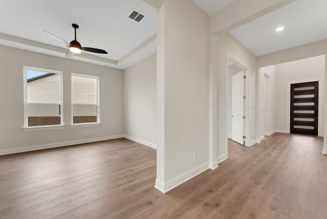 unfurnished room with ceiling fan and light wood-type flooring