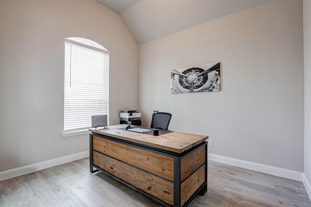 office featuring light hardwood / wood-style flooring and lofted ceiling