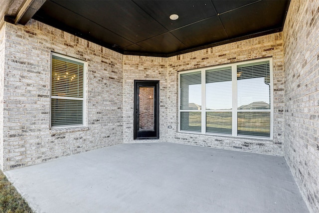 entrance to property featuring a patio area