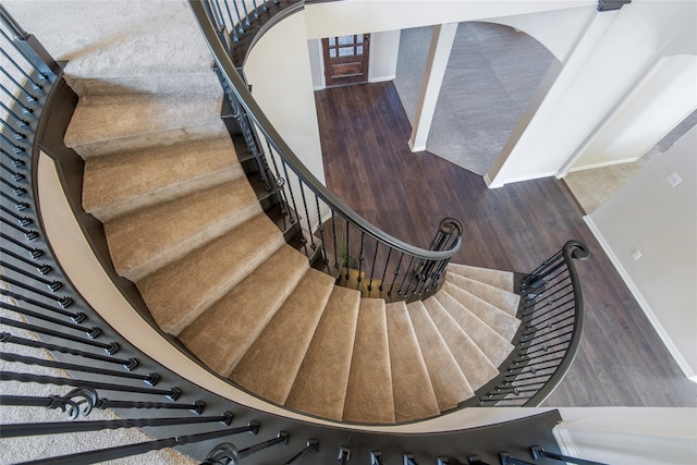 stairway featuring hardwood / wood-style floors