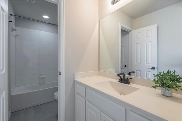 full bathroom with tile patterned floors, vanity, toilet, and tiled shower / bath