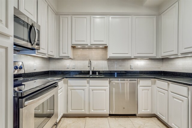 kitchen featuring white cabinets and appliances with stainless steel finishes