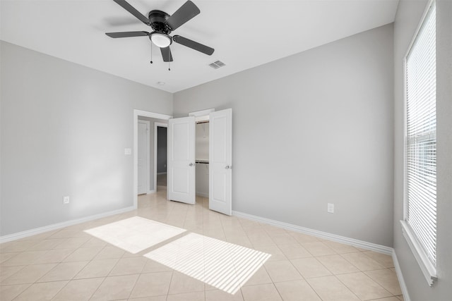 2803 Beechwood St, Granbury, TX 76048 - unfurnished bedroom with light tile patterned floors, baseboards, ceiling fan, and a closet