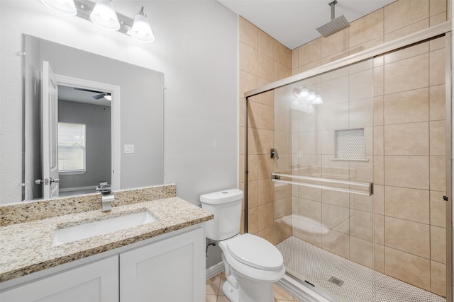 bathroom with walk in shower, tile patterned floors, toilet, and ceiling fan