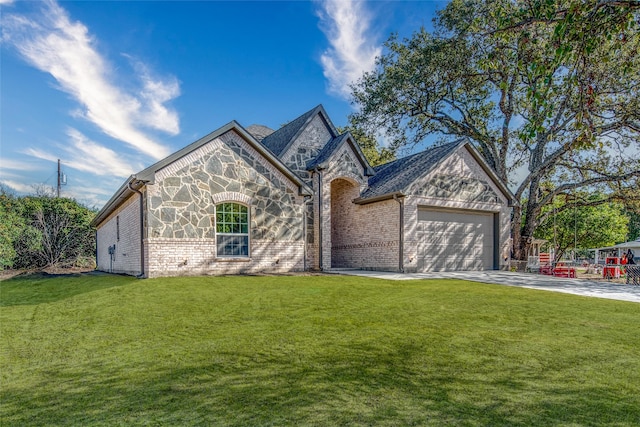 view of front of property featuring a garage and a front lawn