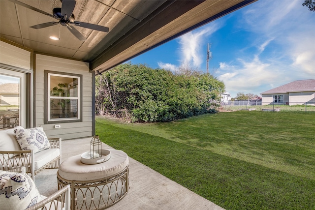 view of yard featuring an outdoor living space, ceiling fan, and a patio area