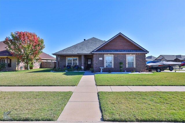 view of front of home with a front lawn