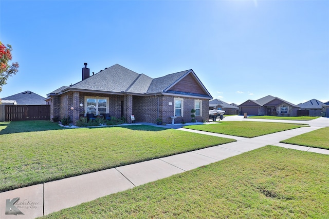 ranch-style home with a front yard