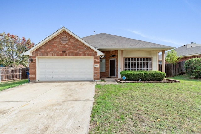 view of front of property featuring a garage and a front yard