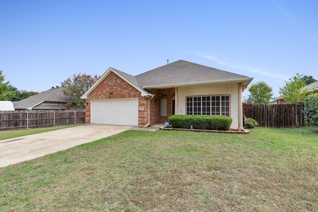 view of front of property featuring a garage and a front lawn