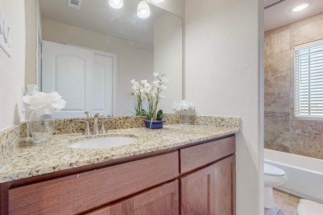 full bathroom with shower / tub combination, vanity, toilet, and tile patterned floors