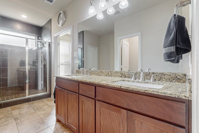 bathroom with vanity and walk in shower