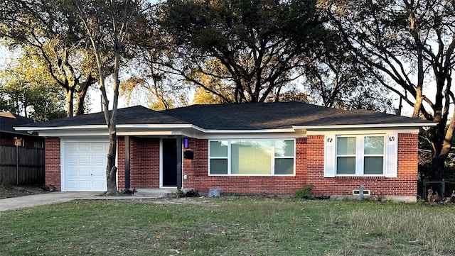 single story home featuring a front yard and a garage