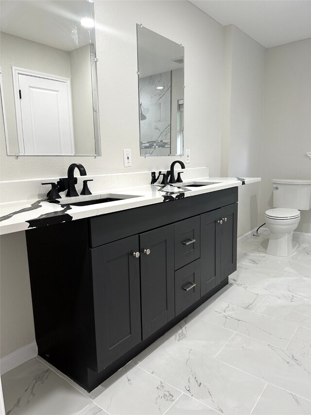 bathroom featuring a shower, toilet, and vanity