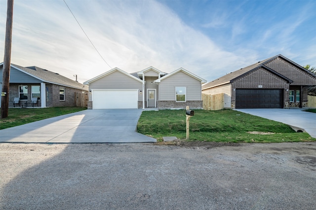 view of front of home with a front yard and a garage