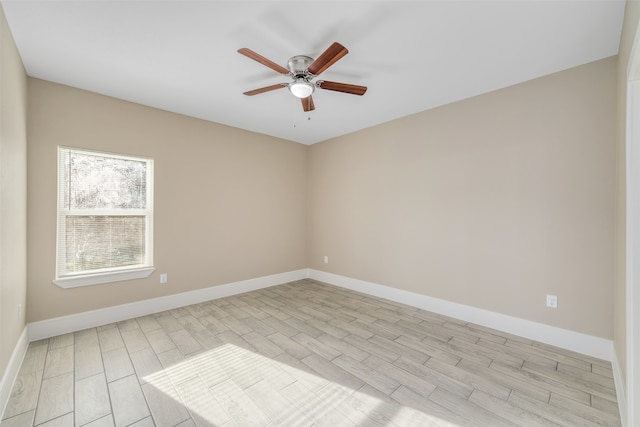 spare room featuring ceiling fan and light wood-type flooring