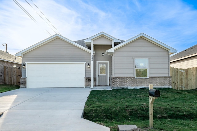 2801 Beechwood St, Granbury, TX 76048 - view of front of house featuring brick siding, driveway, and an attached garage