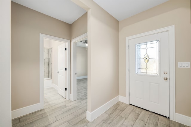 foyer entrance featuring ceiling fan and light hardwood / wood-style floors