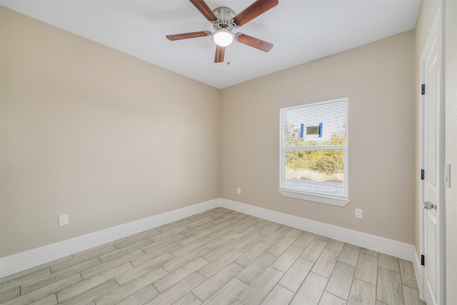 spare room with light hardwood / wood-style flooring and ceiling fan