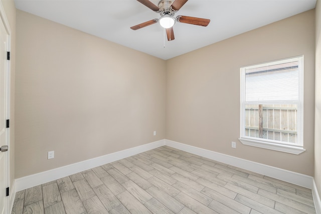 unfurnished room featuring ceiling fan and light wood-type flooring