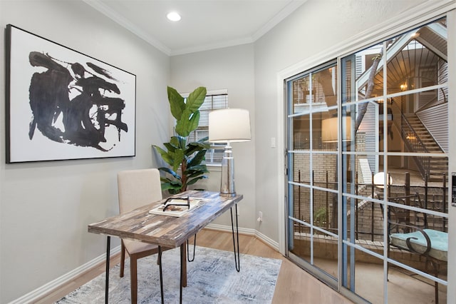 office area with hardwood / wood-style floors and crown molding