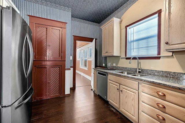 kitchen featuring dark wood-type flooring, light brown cabinetry, appliances with stainless steel finishes, and sink