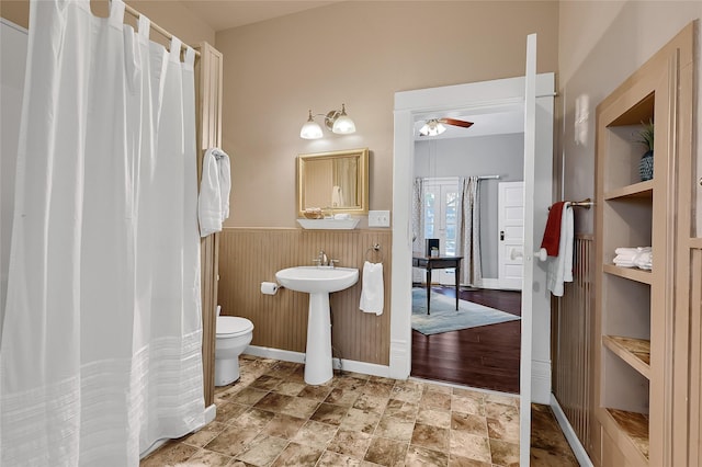 bathroom featuring ceiling fan, sink, and toilet