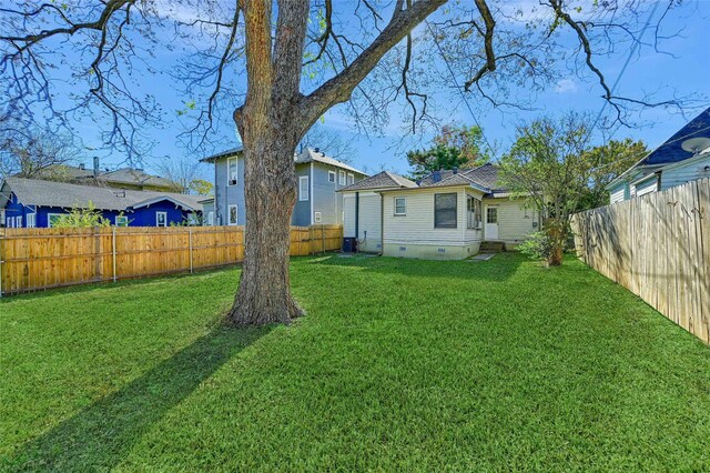 back of property featuring a lawn