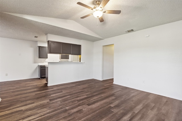 unfurnished living room with a textured ceiling, lofted ceiling, ceiling fan, and dark hardwood / wood-style floors