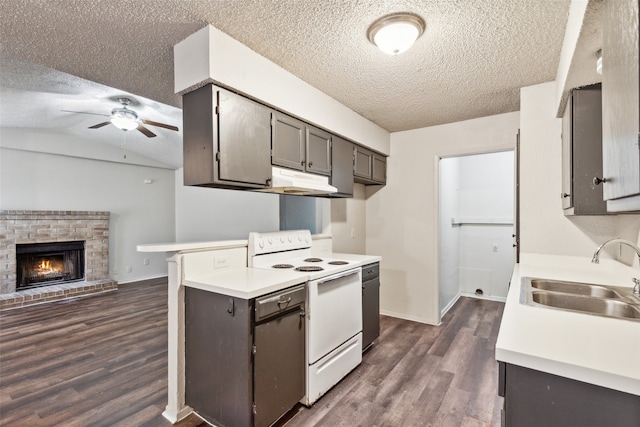 kitchen featuring a brick fireplace, white range with electric stovetop, sink, dark hardwood / wood-style floors, and lofted ceiling