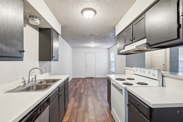 kitchen featuring dark wood-type flooring, sink, electric range, black dishwasher, and a textured ceiling